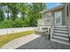 Outdoor area featuring a well-maintained yard, a stone patio, and deck with stairs at 1013 Poppy Fields Ln, Wake Forest, NC 27587