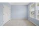 Empty bedroom with carpeted floor, window, and a closet at 1013 Poppy Fields Ln, Wake Forest, NC 27587