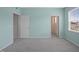 Carpeted bedroom with a closet, doorway, and a window at 1013 Poppy Fields Ln, Wake Forest, NC 27587