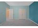 Neutral-toned bedroom showcasing plush carpeting and plenty of closet space at 1013 Poppy Fields Ln, Wake Forest, NC 27587