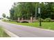 A decorative stone bridge featuring lamp posts and black wrought iron railings at 1013 Poppy Fields Ln, Wake Forest, NC 27587