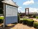 Factory building signage with a list of tenants and shops surrounded by landscaping at 1013 Poppy Fields Ln, Wake Forest, NC 27587
