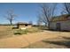 Historic park buildings with gravel sidewalk and various trees at 1013 Poppy Fields Ln, Wake Forest, NC 27587