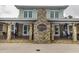 Community clubhouse with a welcoming stone facade and visible pool access at 1013 Poppy Fields Ln, Wake Forest, NC 27587