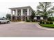 Community clubhouse featuring stone accents, flower beds, and ample parking at 1013 Poppy Fields Ln, Wake Forest, NC 27587