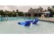 Resort-style community pool featuring in-water lounge chairs and a water fountain feature at 1013 Poppy Fields Ln, Wake Forest, NC 27587