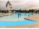 Community pool area with splash fountain and lounge chairs, perfect for Gathering fun and relaxation at 1013 Poppy Fields Ln, Wake Forest, NC 27587