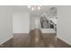 Bright dining room with hardwood floors, a modern chandelier, and large windows offering plenty of natural light at 1013 Poppy Fields Ln, Wake Forest, NC 27587
