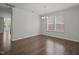 Dining room with hardwood floors, a chandelier, and large windows offering plenty of natural light at 1013 Poppy Fields Ln, Wake Forest, NC 27587
