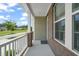 Charming front porch with brick columns and white railings at 1013 Poppy Fields Ln, Wake Forest, NC 27587