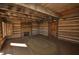 Rustic interior of historic cabin featuring stone fireplace, wood floors, and log walls at 1013 Poppy Fields Ln, Wake Forest, NC 27587
