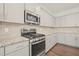 Well-appointed kitchen with stainless steel range and microwave, complemented by granite countertops and ample cabinet space at 1013 Poppy Fields Ln, Wake Forest, NC 27587