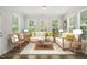 Bright and spacious living room featuring stylish furnishings and large windows at 1013 Poppy Fields Ln, Wake Forest, NC 27587