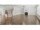 Spacious living room with fireplace, staircase, and hardwood floors at 1013 Poppy Fields Ln, Wake Forest, NC 27587