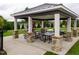Enjoy outdoor picnics at the pavilion with stone-based columns and multiple tables for dining at 1013 Poppy Fields Ln, Wake Forest, NC 27587