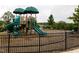 Community playground featuring climbing structures, slides, and swings for enjoyment at 1013 Poppy Fields Ln, Wake Forest, NC 27587