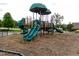 Community playground equipment with slides and climbing structure for outdoor recreation at 1013 Poppy Fields Ln, Wake Forest, NC 27587