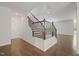 View of a staircase with decorative metal and wood handrail, leading to the second floor at 1013 Poppy Fields Ln, Wake Forest, NC 27587