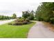 Well maintained community walking path with landscaped borders and shaded sidewalks at 1013 Poppy Fields Ln, Wake Forest, NC 27587