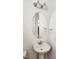 Elegant bathroom vanity featuring a vessel sink, chrome faucet, and sleek oval mirror at 1016 Dotson Way, Apex, NC 27523