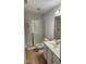 Bathroom with glass enclosed shower, tile floors and one-sink vanity at 1016 Dotson Way, Apex, NC 27523