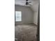 Bedroom featuring carpeted floors, neutral paint, and natural light through a window at 1016 Dotson Way, Apex, NC 27523