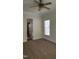 Neutral bedroom with carpet, white trim, ceiling fan, and a window for natural lighting at 1016 Dotson Way, Apex, NC 27523