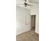Clean bedroom featuring carpeted floors, neutral paint, modern ceiling fan, and open doorway at 1016 Dotson Way, Apex, NC 27523