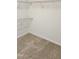 Walk-in closet with neutral carpet and white wire shelving for optimal storage and organization at 1016 Dotson Way, Apex, NC 27523
