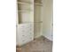 Custom closet featuring built-in shelves, drawers, and rods for organization at 1016 Dotson Way, Apex, NC 27523