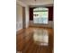 Classic dining room featuring a chandelier, wainscoting, and a large window for natural light at 1016 Dotson Way, Apex, NC 27523
