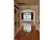 Inviting dining room showcases an archway entrance, hardwood floors, and wainscoting details at 1016 Dotson Way, Apex, NC 27523