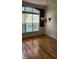 Cozy dining room featuring wood floors, a chandelier, and a large window at 1016 Dotson Way, Apex, NC 27523