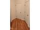 Hallway features hardwood floors and white doors at 1016 Dotson Way, Apex, NC 27523