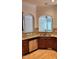 Charming kitchen with stainless dishwasher, sink, granite counters, and wood cabinetry at 1016 Dotson Way, Apex, NC 27523