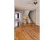 Spacious living room showcasing wood floors, staircase, and neutral walls at 1016 Dotson Way, Apex, NC 27523