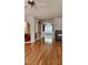 Bright living room featuring wood floors, pillars, arches, and natural lighting at 1016 Dotson Way, Apex, NC 27523