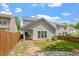 Backyard boasts a grassy area, fenced perimeter, and patio, perfect for outdoor activities at 1016 Goldmist Ln, Durham, NC 27713