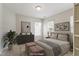 Staged bedroom with contemporary decor, soft lighting, and neutral tones for a serene ambiance at 1016 Goldmist Ln, Durham, NC 27713