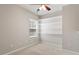Cozy bedroom with ceiling fan and built-in shelving at 1016 Goldmist Ln, Durham, NC 27713