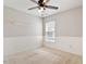 Bedroom with chair rail, ceiling fan, and neutral carpet at 1016 Goldmist Ln, Durham, NC 27713