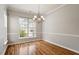 Dining area features natural light, wood floors, and neutral walls at 1016 Goldmist Ln, Durham, NC 27713
