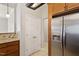 Kitchen area features stainless steel refrigerator and granite countertops at 1016 Goldmist Ln, Durham, NC 27713