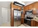 Kitchen with stainless steel appliances, pantry, and wood cabinets at 1016 Goldmist Ln, Durham, NC 27713