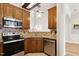 Kitchen with stainless steel appliances, granite counters, and tile backsplash at 1016 Goldmist Ln, Durham, NC 27713