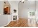 Bright living room features a fireplace, high ceilings, wood floors, and access to the outdoors at 1016 Goldmist Ln, Durham, NC 27713