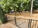 Fully-equipped community playground with various climbing structures, slides, and swings near fencing at 1016 Goldmist Ln, Durham, NC 27713