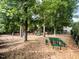 A sprawling community playground with slides, swings, climbing structures, and picnic tables at 1016 Goldmist Ln, Durham, NC 27713
