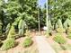 Gated entrance to the community playground, surrounded by trees and greenery at 1016 Goldmist Ln, Durham, NC 27713