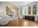 Welcoming foyer with hardwood floors, staircase, and abundant natural light, creating an inviting entrance at 105 Gorge Ct, Cary, NC 27518